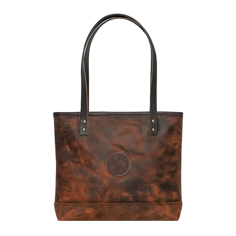 Brown leather tote bag with black handles on a white background