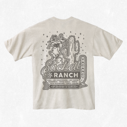 Beige t-shirt with graphic design on the back featuring text and a cactus illustration.