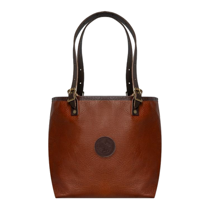 Brown leather tote bag with gold accents on a white background